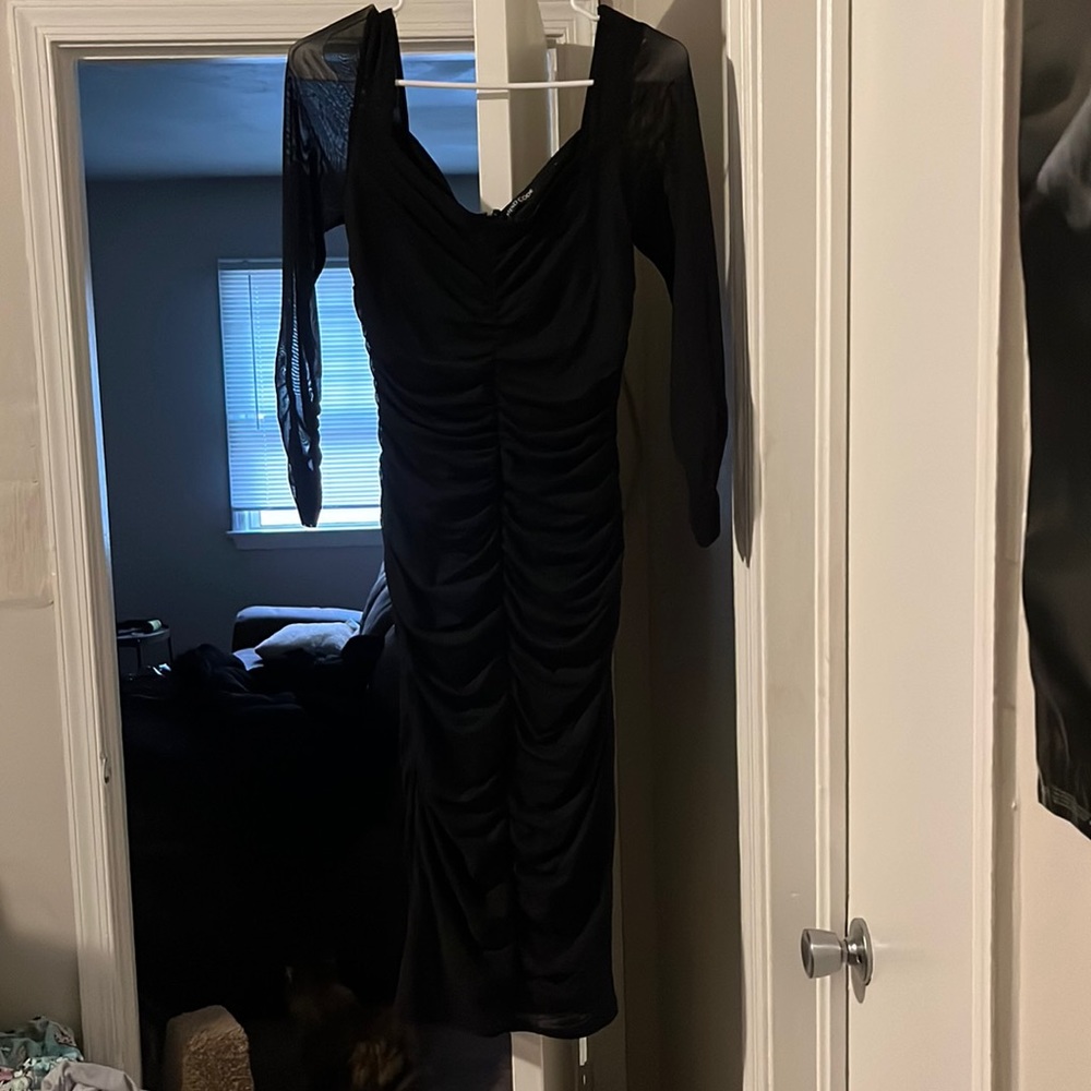 Tight black ribbed dress